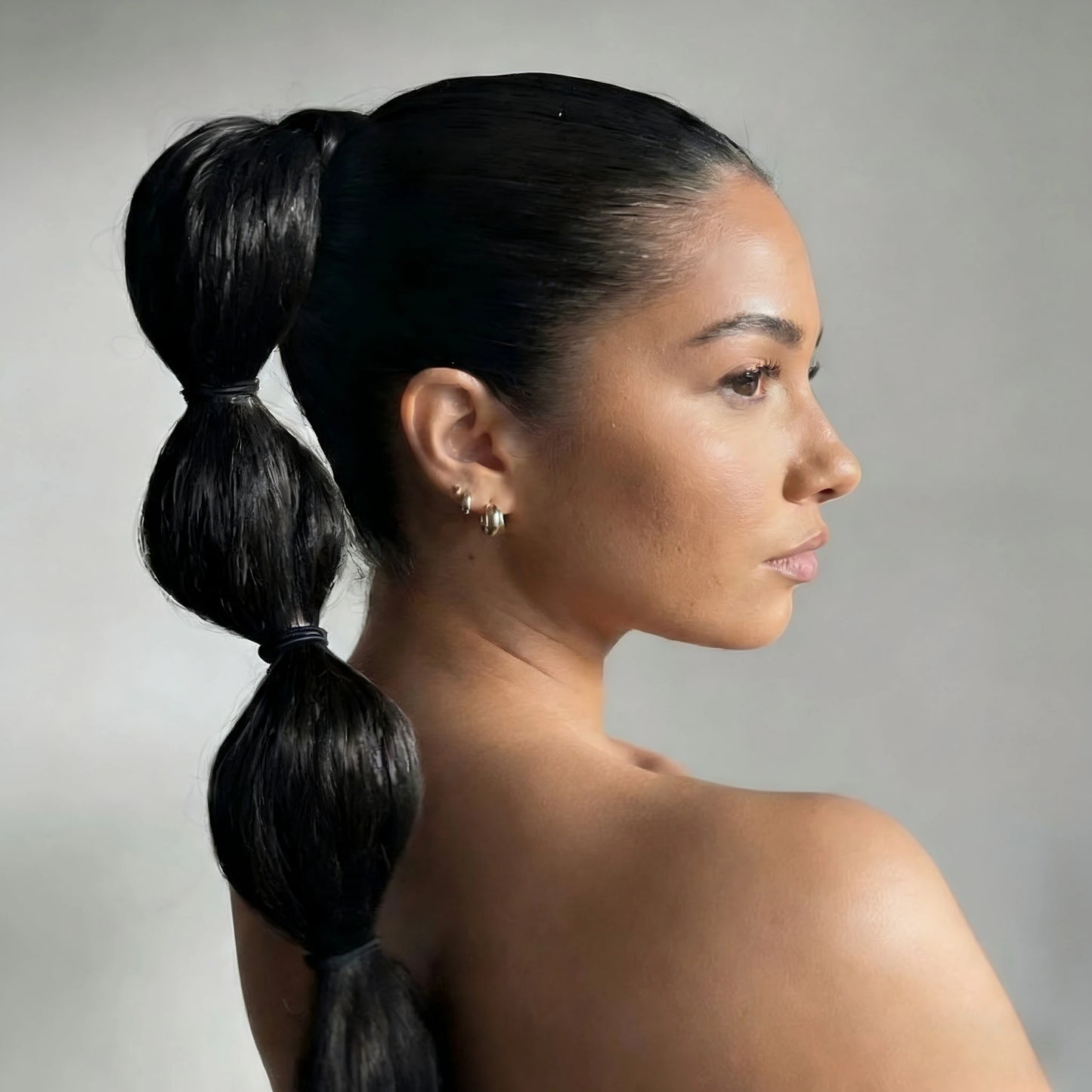 Long ponytail extension styled as a trendy DIY bubble braid