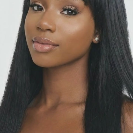 A video demonstration showing the natural wearing effect of a long straight human hair wig with a black fringe for women