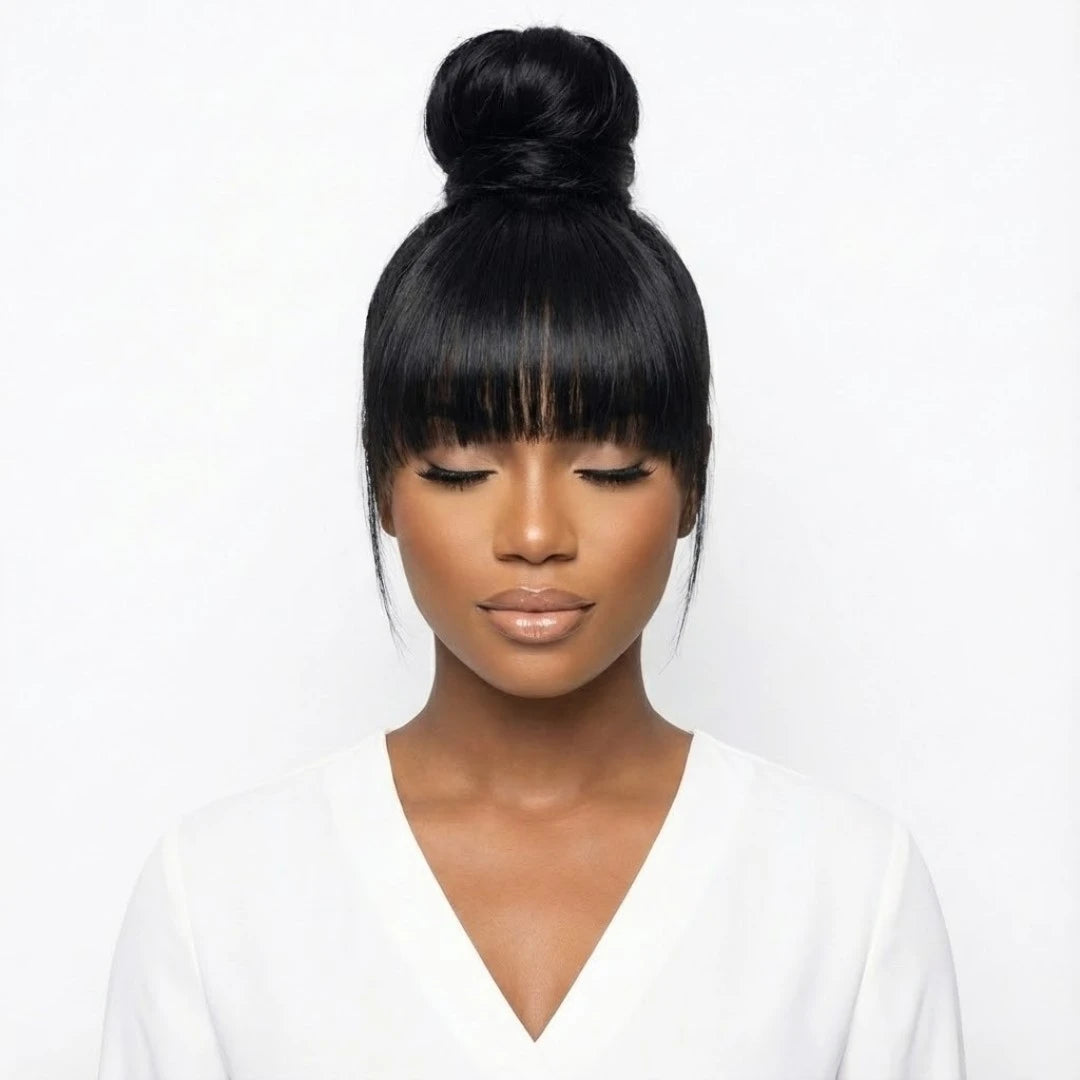Straight human hair fringe wig styled in a high top knot bun